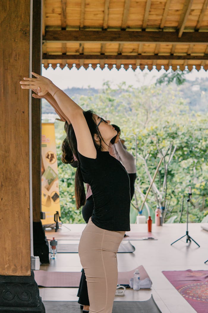 The Art of Drawing Readers In: Your attractive post title goes here Woman practicing yoga pose in a serene outdoor setting, Jawa Barat.